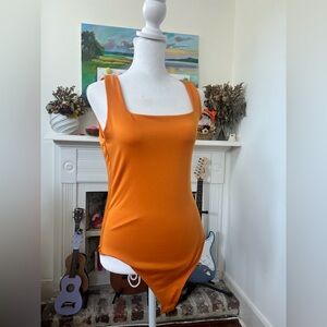 Orange bodycon bodysuit with round neckline #festivalvibes